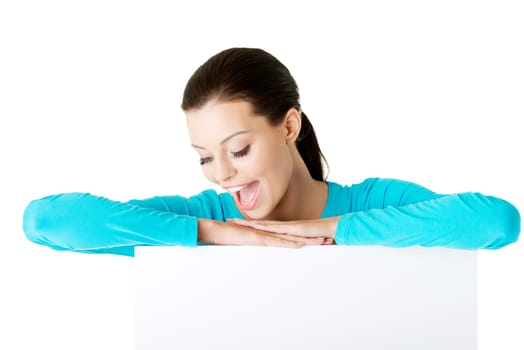 Portrait young happy woman with blank board , isolated on white