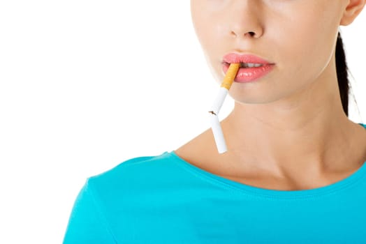 Young woman with broken cigarette. Stop smoking concept.