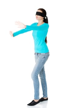 Portrait of the young blindfold woman using senses, isolated on white