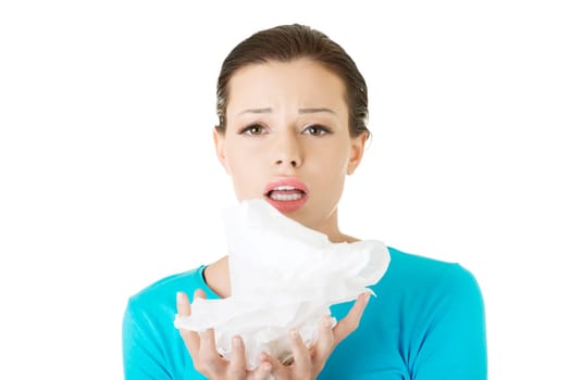 Young woman with tissue - sneezing , isolated on white