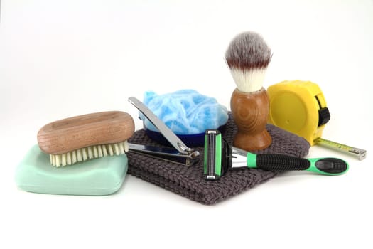 A collection of bathroom supplies used by a simple working man, also seen with a tape measure.
