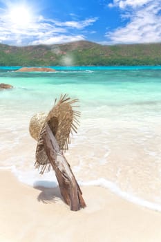 Sun hat on the white sandy beach