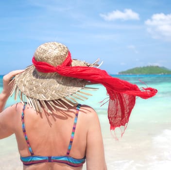 Woman with sun hat on the beach - Seychelles
