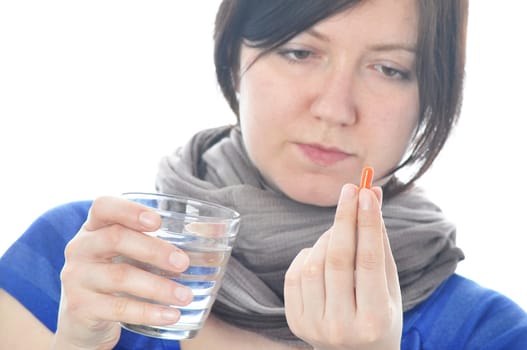 Woman with pill over white background