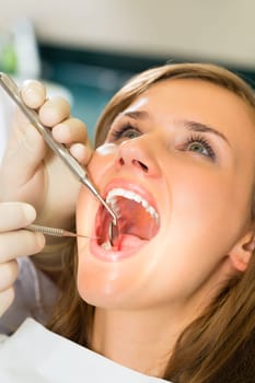 Female patient with dentist during treatment