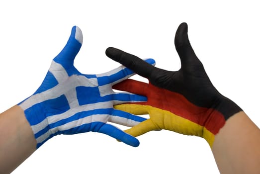two hands painted with the colors of germany and greece