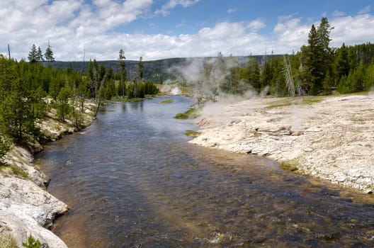 River and geyser in Yellowstone National Park in Wyoming in the United States of America