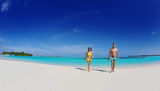 happy young asian couple have fun and romantic time at  summer on beautiful white sand beach