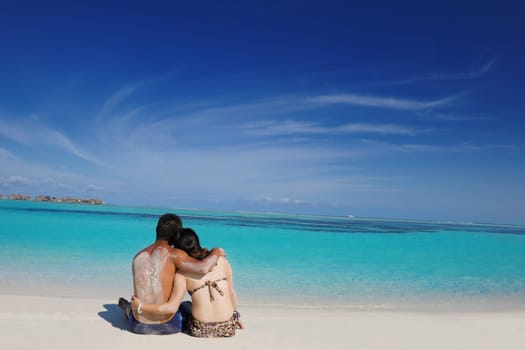 happy young asian couple have fun and romantic time at  summer on beautiful white sand beach