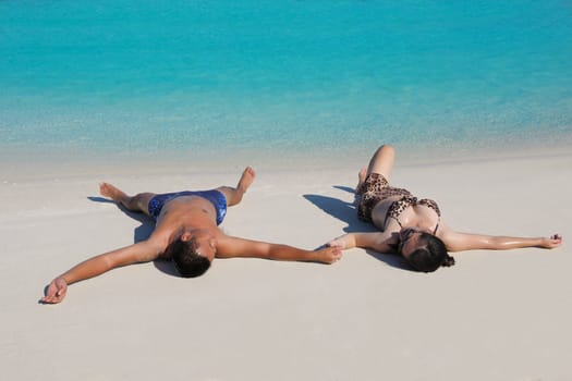 happy young asian couple have fun and romantic time at  summer on beautiful white sand beach