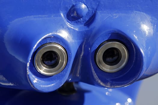 Blue coin-operated telescope