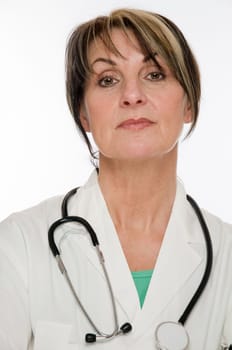 Side head and shoulders shot of a middle-aged doctor in a white coat and stethoscope placed around her neck looking at the camera against a white background