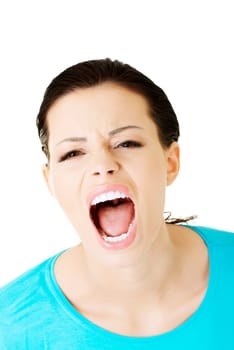 Young casual woman screaming with anger, isolated on white
