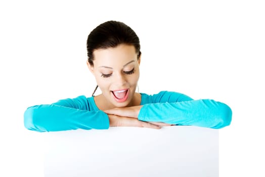 Portrait young happy woman with blank board , isolated on white