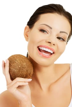 Beautiful woman with coconut in hands over white background