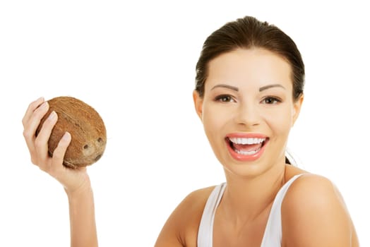 Beautiful woman with coconut in hands over white background