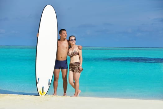 happy young asian couple have fun and romantic time at  summer on beautiful white sand beach