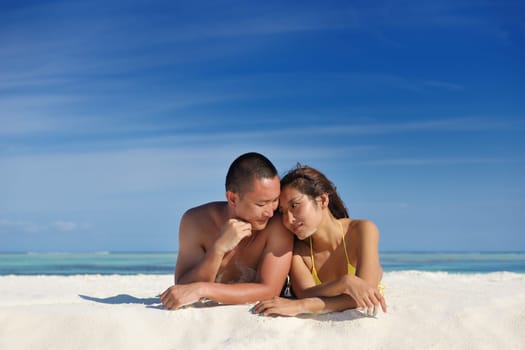 happy young asian couple have fun and romantic time at  summer on beautiful white sand beach