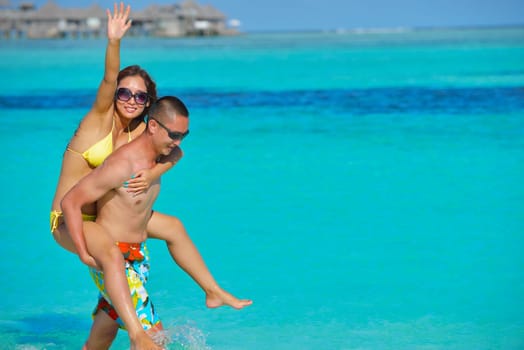 happy young asian couple have fun and romantic time at  summer on beautiful white sand beach