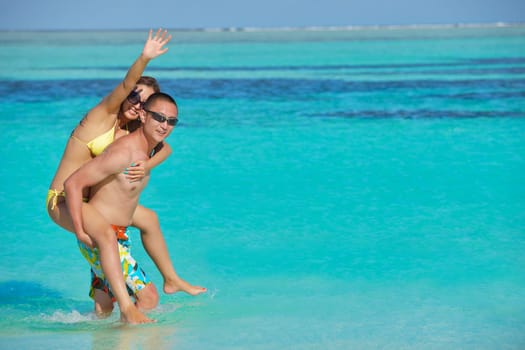 happy young asian couple have fun and romantic time at  summer on beautiful white sand beach