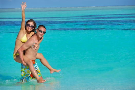 happy young asian couple have fun and romantic time at  summer on beautiful white sand beach