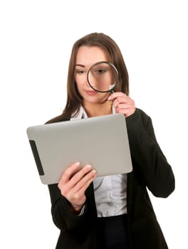 Businesswoman with tablet pc and magnifying glass