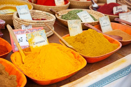 Differents Spices on wooden bowls, street market