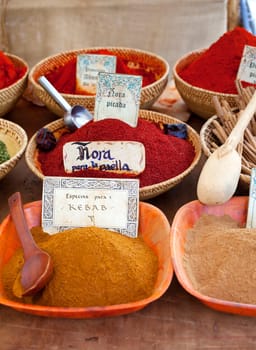 Differents Spices on wooden bowls, street market