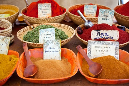 Differents Spices on wooden bowls, street market