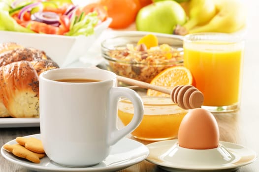 Breakfast including coffee, bread, honey, orange juice, muesli and fruits