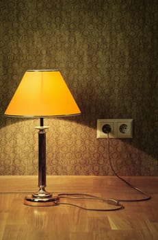 Turned On Old Lamp Near The Wall