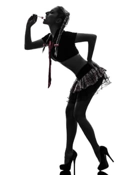 one caucasian sexy woman school student costume  portrait  in silhouette studio isolated on white background