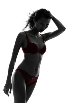 one beautiful asian woman  in red underwear  silhouette studio isolated on white background