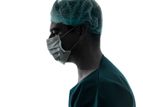 one caucasian doctor surgeon man portrait profile with face mask medical worker silhouette isolated on white background