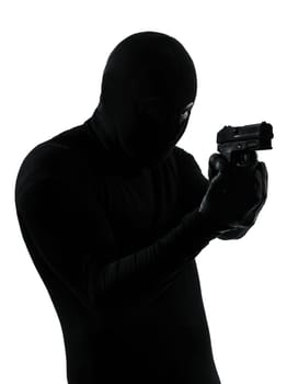 thief criminal terrorist holding gun portrait in silhouette studio isolated on white background