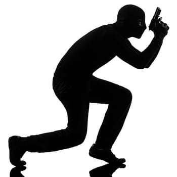 thief criminal terrorist in silhouette studio isolated on white background