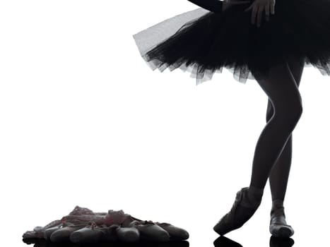 one caucasian young woman ballerina ballet dancer dancing with tutu in silhouette studio on white background