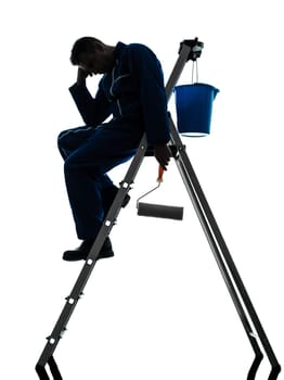 one caucasian man house painter worker silhouette in studio on white background