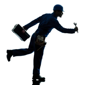 one caucasian repairman worker running urgency silhouette in studio on white background