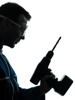 one caucasian man construction worker holding drill silhouette in studio on white background