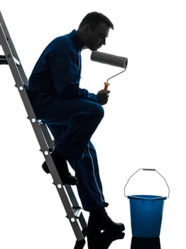one caucasian man house painter worker silhouette in studio on white background