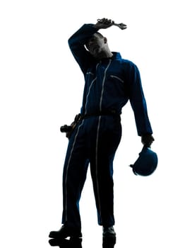 one caucasian repairman worker tired fatigue silhouette in studio on white background