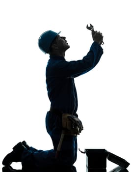 one caucasian repairman worker despair praying silhouette in studio on white background