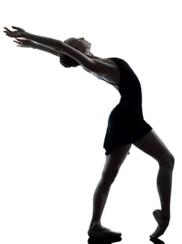one caucasian young woman ballerina ballet dancer stretching warming up in silhouette studio on white background