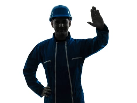 one caucasian man construction worker saluting smiling silhouette portrait in studio on white background
