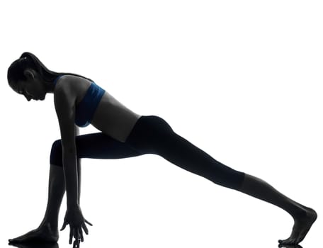 one caucasian woman exercising yoga in silhouette studio isolated on white background