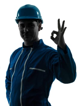 one caucasian man construction worker smiling silhouette portrait okay gesture in studio on white background