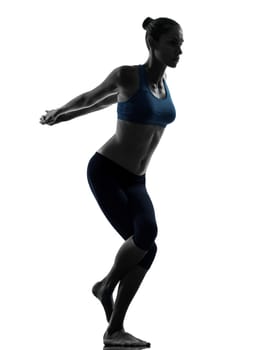 one caucasian woman exercising yoga yoga camel pose in silhouette studio isolated on white background