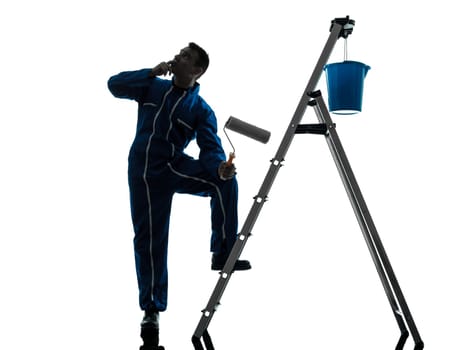 one caucasian man house painter worker silhouette in studio on white background