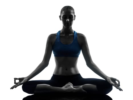 one caucasian woman exercising yoga meditating in silhouette studio isolated on white background